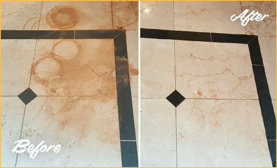 Before and After Picture of a White Cross Hard Surface Restoration Service on a Marble Floor to Eliminate Rust Stains